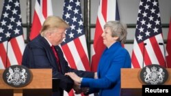 Britain's Prime Minister Theresa May and U.S. President Donald Trump attend a joint news conference at the Foreign & Commonwealth Office, in London, Britain June 4, 2019. Stefan Rousseau/Pool via REUTERS