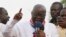 FILE - New Patriotic Party presidential candidate Nana Akufo-Addo, shown protesting in Accra after the 2012 election of John Dramani Mahama, is "campaigning hard" to defeat him in the next election, NPP acting chairman Freddie Blay says.