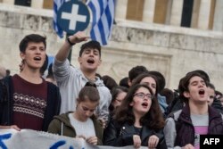 Pupils demonstrate against a new educational reform, changing the exams system for higher education, in central Athens, Greece, April 22, 2019.