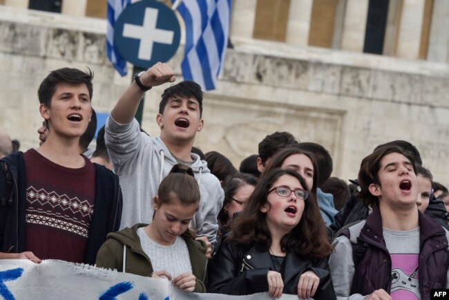 Pupils demonstrate against a new educational reform, changing the exams system for higher education, in central Athens, Greece, April 22, 2019.