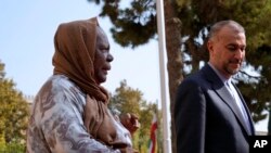 FILE - South Africa's Foreign Minister Naledi Pandor, left, is welcomed by her Iranian counterpart Hossein Amirabdollahian in Tehran, Iran, Oct. 22, 2023.