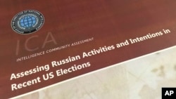 FILE - A part of the declassified version Intelligence Community Assessment on Russia's efforts to interfere with the U.S. political process is photographed in Washington, Jan. 6, 2017. 