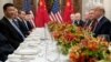 US President Donald Trump (R) and China's President Xi Jinping (L) along with members of their delegations, hold a dinner meeting at the end of the G20 Leaders' Summit in Buenos Aires, on December 01, 2018