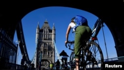 A cyclist is seen on Tower Bridge, following the outbreak of the coronavirus disease (COVID-19), London, Britain, May 15, 2020. 