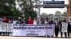 FILE - Human rights group Odhikar activists and volunteers demonstrate against enforced disappearances, in Bangladesh's Khulna district, on International Human Rights Day, Dec. 10, 2021.