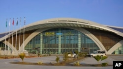 This Jan. 10, 2025, photo provided by Pakistan Airports Authority on Feb. 21, 2025, shows security forces officials outside the newly constructed Gwadar airport, in Pakistan. 