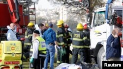 Israeli rescue forces work at the scene of a truck ramming incident in Jerusalem, Jan. 8, 2017. 