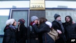 Gay rights activists kiss during a protest against the proposed "homosexual propaganda" measure outside the Duma, Russia's lower house of Parliament, in Moscow, January 22, 2013. 