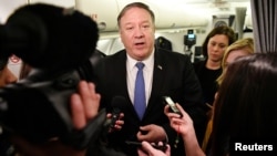 FILE - U.S. Secretary of State Mike Pompeo speaks to reporters in flight after a previously unannounced trip to Baghdad, Iraq, May 8, 2019.