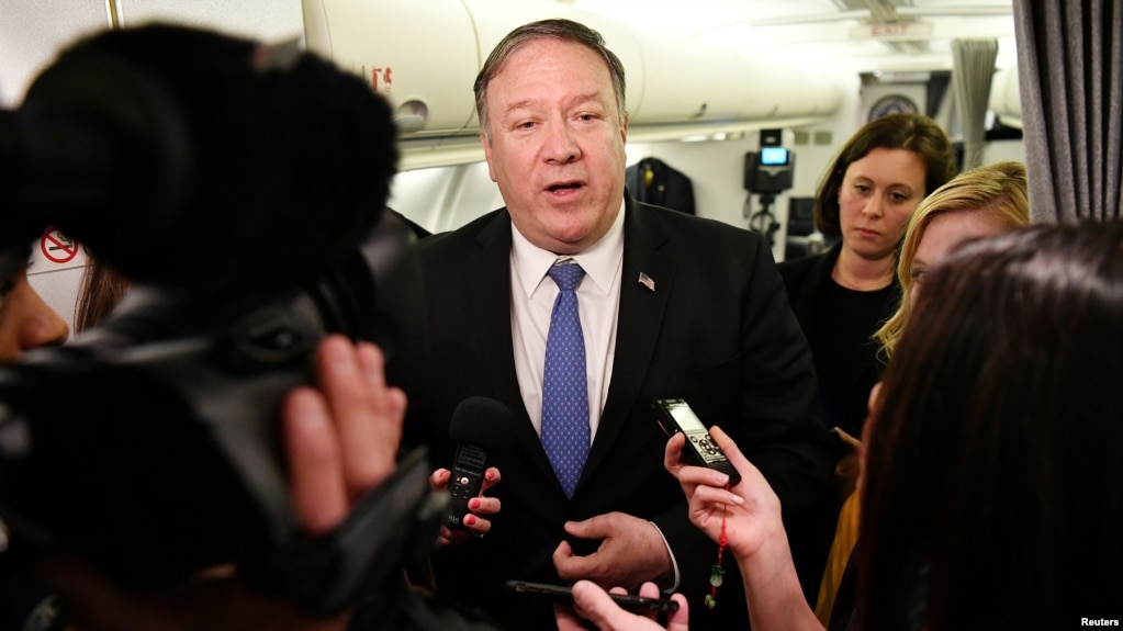 U.S. Secretary of State Mike Pompeo speaks to reporters in flight after a previously unannounced trip to Baghdad, Iraq, May 8, 2019.