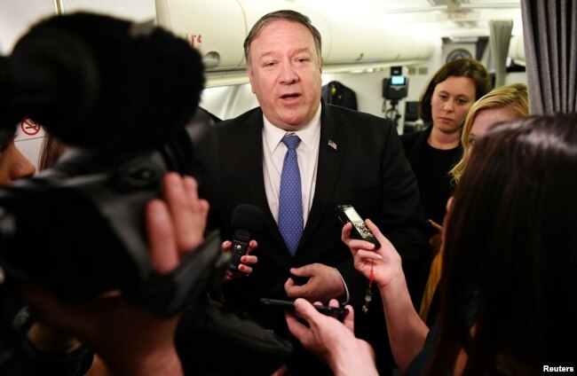 U.S. Secretary of State Mike Pompeo speaks to reporters in flight after a previously unannounced trip to Baghdad, Iraq, May 8, 2019.