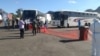 Buses carrying Malawian migrant workers from South Africa arrive at Mwanza Border in southern Malawi. (Courtesy of Pasqually Zulu, Mwanza Border Immigration)