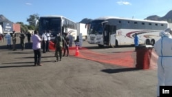 Buses carrying Malawian migrant workers from South Africa arrive at Mwanza Border in southern Malawi. (Courtesy of Pasqually Zulu, Mwanza Border Immigration)