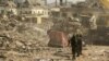 Members of security forces stand near damaged buildings and vehicles after a blast in Ibadan, Nigeria, January 17, 2024. 