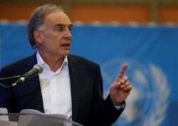 FILE - Jean Arnault, then the the U.N. secretary-general's special representative for Colombia, speaks in Funza, Colombia, Sept. 22, 2017.