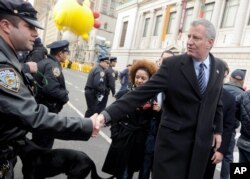 New York City Bill de Blasio, right, at New York's Thanksgiving Day Parade.