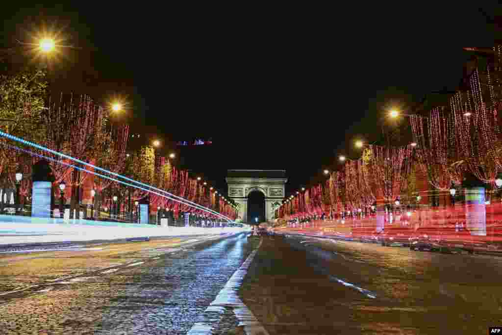 A general view of the Champs-Elysees Avenue and the Arc de Triomphe after the inauguration of the Christmas season light, in Paris, France.
