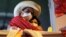 FILE - Pedro Castillo hugs his wife Lilia Paredes Navarro as he stands before supporters at his closing campaign rally in Lima, Peru, June 3, 2021. Mexico recently announced that it has granted asylum to Paredes Navarro and other members of Castillo's family. 