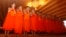 Members of Wild Boars soccer team pray during a ceremony marking the completion of their serving as novice Buddhist monks, following their dramatic rescue from a cave in Mae Sai district, Chiang Rai province, northern Thailand, Aug. 4, 2018.