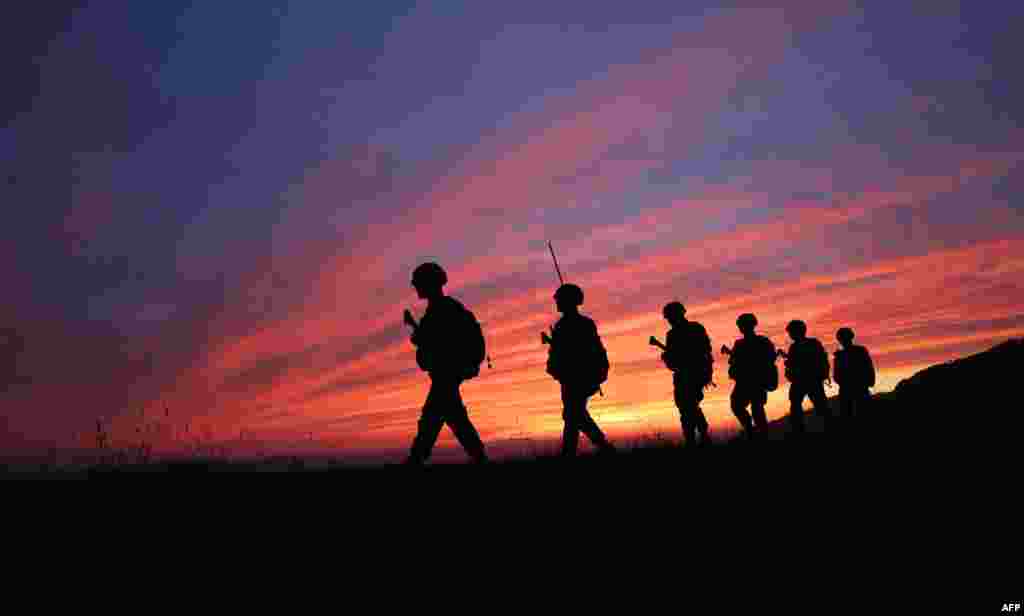 South Korean marines patrol during sunset on the island of Yeonpyeong near the &#39;northern limit line&#39; sea boundary with North Korea.