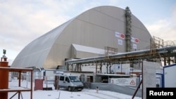 A general view shows the "New Safe Confinement" structure over the old sarcophagus covering the damaged fourth reactor at the Chernobyl nuclear power plant in Chernobyl, Ukraine, Nov. 29, 2016.