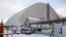 A general view shows the "New Safe Confinement" structure over the old sarcophagus covering the damaged fourth reactor at the Chernobyl nuclear power plant in Chernobyl, Ukraine, Nov. 29, 2016.