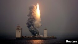 A Long March 11 carrier rocket takes off from a mobile launch platform in the Yellow Sea off Shandong province, China, June 5, 2019.