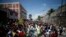 Haitians respond to a nationwide push to block streets and paralyze the country's economy as they press for President Jovenel Moise to give up power, in Port-au-Prince, Haiti, Sept. 30, 2019.