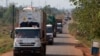 FILE - A convoy of trucks carrying food from the United Nations World Food Programme (WFP) that was stuck at the Cameroon-Central African Republic border for several days due to sectarian insecurity on the road, approaches the north of the capital Bangui.