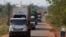 FILE - A convoy of trucks carrying food from the United Nations World Food Programme (WFP) that was stuck at the Cameroon-Central African Republic border for several days due to sectarian insecurity on the road, approaches the north of the capital Bangui.