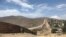 A fence runs along the U.S.-Mexico border.