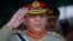 FILE - Pakistani Army Chief General Ashfaq Kayani salutes during a ceremony in Quetta on October 11, 2011.