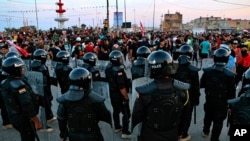 Security forces prevent anti-government protesters from setting up tents in Basra, Iraq, Nov. 6, 2020. 