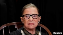 FILE - U.S. Supreme Court Associate Justice Ruth Bader Ginsburg is seen during a group portrait session for the new full court at the Supreme Court in Washington, Nov. 30, 2018. 