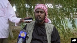 Al-Shabab spokesperson Ali Mohamud Rage holds a news conference in Mogadishu, Somalia, threatening Kenya, October 17, 2011.