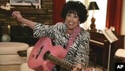 FILE - In this May 19, 2009, file photo, Wanda Jackson plays a pink guitar in her home in Oklahoma City.