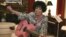 FILE - In this May 19, 2009, file photo, Wanda Jackson plays a pink guitar in her home in Oklahoma City.