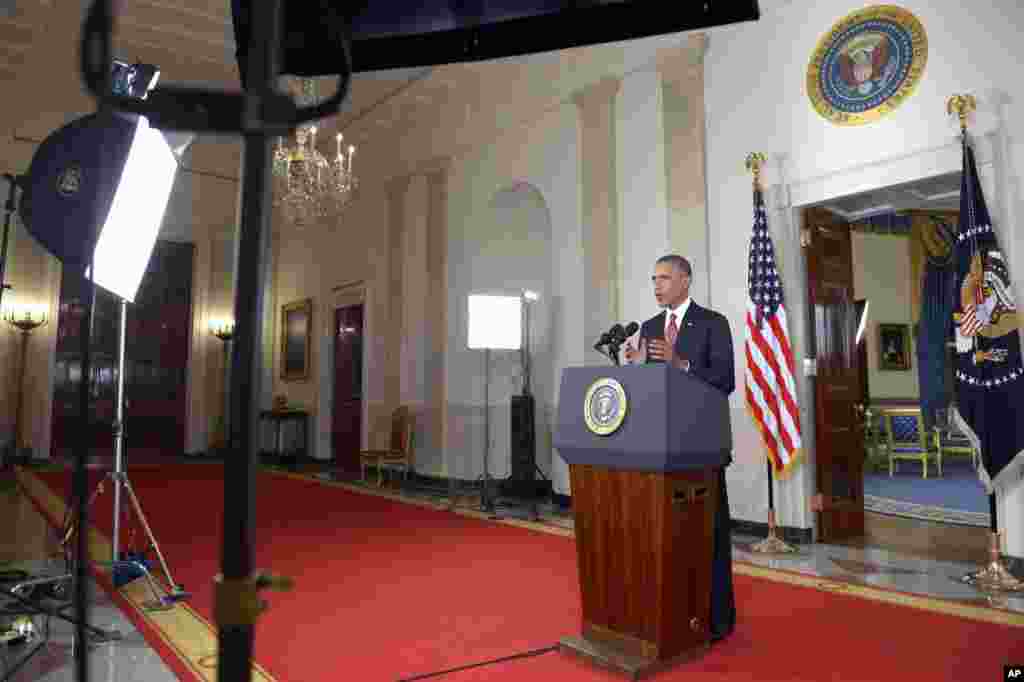 President Barack Obama addresses the nation from the Cross Hall in the White House, ordering the United States into a broad military campaign to “degrade and ultimately destroy” Islamic State militants, in Washington, Sept. 10, 2014.
