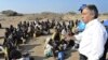 UN refugee agency chief Antonio Guterres (R) speaks to Ethiopian illegal immigrants from the Oromo region waiting for smugglers' boats to cross the Gulf of Aden into Yemen. Each year tens of thousands of Ethiopians and Somalis make the perilous crossing t