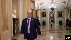 Sen. Chris Coons arrives in Congress, Nov. 14, 2018, before a call for a floor vote to protect Special Counsel Robert Mueller.