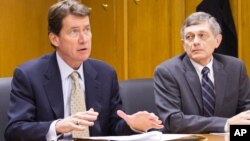 FILE - Bill Hagerty, former Tennessee Economic and Community Development Commissioner, (left) and fiscal policy adviser Paul VanderMeer appear before a state commission, Feb.5, 2014. 