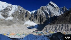 This photograph taken on April 18, 2014, shows Everest Base Camp from Crampon Point, the entrance into the Khumbu icefall below Mount Everest, following an avalanche that killed sixteen Nepalese sherpas in the Khumbu icefall.