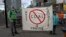 Protesters hold a banner against mining coking coal in the West Cumbria area of northern England, as they stand near the Scottish Event Campus, the venue for the COP26 U.N. Climate Summit in Glasgow on Nov. 2, 2021.