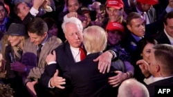 (FILES) In this file photo taken on November 09, 2016 Republican president-elect Donald Trump (front) hugs his brother Robert Trump after delivering his acceptance speech in New York City. - The WHite House announced Robert Trump, younger brother of…