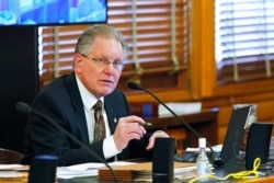 FILE - Kansas state Sen. Mike Thompson speaks about a bill rewriting emergency management laws, Feb. 25, 2021, in Topeka, Kan. He was frustrated that officials in Gov. Laura Kelly's administration wouldn't predict when a COVID emergency would end.