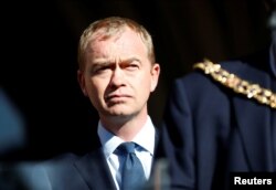 Tim Farron, the leader of Britain's Liberal Democrat Party, takes part in a vigil for the victims of an attack on concertgoers at Manchester Arena, in central Manchester, England, May 23, 2017.