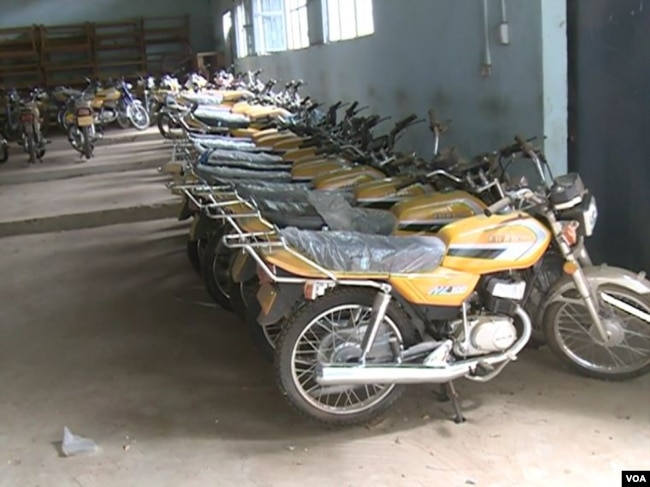 Motorcycles given to vigilantes are kept in Mora since the war has abated. (M.E. Kindzeka/VOA)