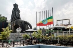 Ethiopia's national flag is lowered in front of the national theater in Addis Ababa, as the country mourns, June 20, 2019.