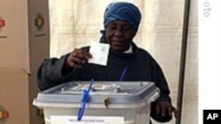FILE: A woman casts her voter in the last general election.