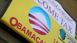 FILE - A sign on an insurance store advertises Obamacare in San Ysidro, San Diego, California, U.S.